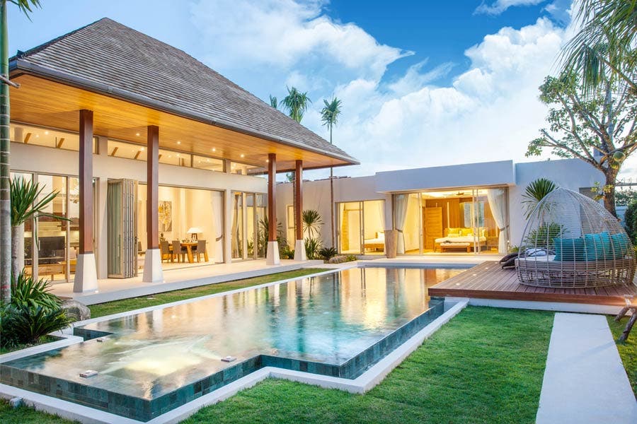 beautiful photo of big house with pool
